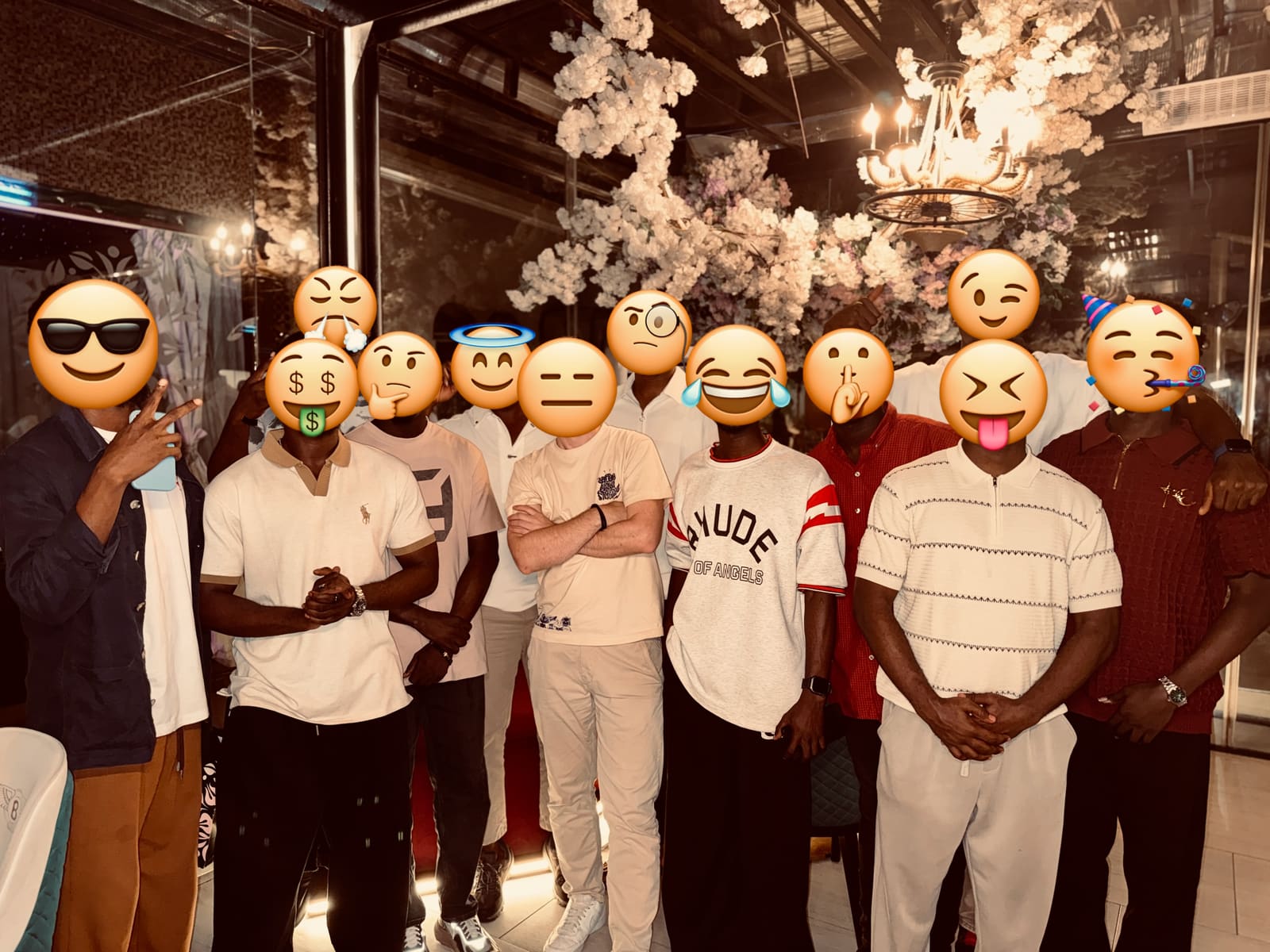 Attendees of the Lagos meetup standing together, every face covered by an emoji.